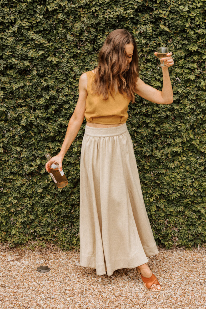 Woman wearing long linen skirt.