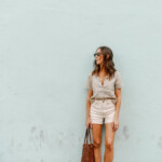Camille Styles wearing white denim shorts.
